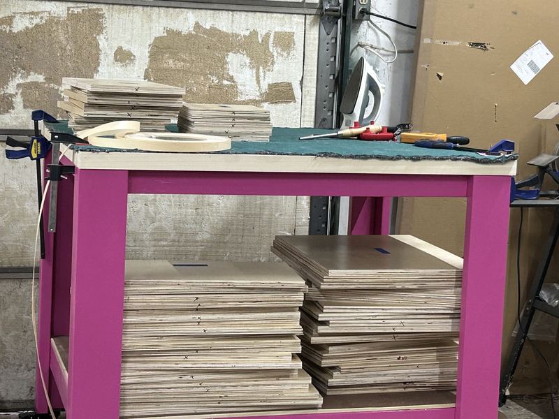Cut locker parts stacked on the edge-banding station