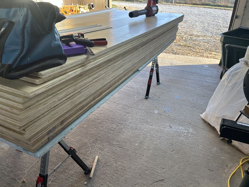 Stack of prefinished birch plywood sheets